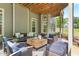 Spacious outdoor patio with stylish seating, ceiling fan, and wooden ceiling at 1308 Green Oaks Pkwy, Holly Springs, NC 27540