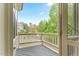 Tranquil porch area with a view of a beautifully landscaped neighborhood at 1308 Green Oaks Pkwy, Holly Springs, NC 27540