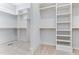Spacious walk-in closet with custom shelving and ample storage at 1308 Green Oaks Pkwy, Holly Springs, NC 27540
