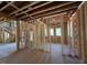 View of the interior with staircase and large windows, showcasing natural light and open design at 1500 Ridge Rd, Raleigh, NC 27607