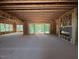 Open-concept living room featuring fireplace, sliding doors to the back and multiple windows for natural light at 1500 Ridge Rd, Raleigh, NC 27607