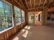 Sun-drenched sun room featuring windows and a glass sliding door with a view of the outdoors at 1500 Ridge Rd, Raleigh, NC 27607