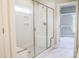Bright bathroom boasts a glass enclosed tiled shower with a bench seat, perfect for relaxing at 155 Diamond Creek Dr, Zebulon, NC 27597