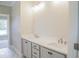 Modern bathroom featuring double vanity, soft gray cabinets, and brushed nickel fixtures at 155 Diamond Creek Dr, Zebulon, NC 27597