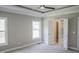 Spacious bedroom features a trey ceiling, lots of natural light, and ensuite bath with a tiled shower at 155 Diamond Creek Dr, Zebulon, NC 27597