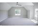 Spacious bedroom boasts plush carpet, ceiling fan, two windows providing ample sunlight at 155 Diamond Creek Dr, Zebulon, NC 27597