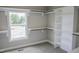 This walk-in closet offers custom built-in shelving and natural light at 155 Diamond Creek Dr, Zebulon, NC 27597