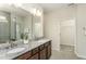 Elegant bathroom with a double vanity, granite countertops, and a glass-enclosed shower at 1606 Garden Park Cir, Fuquay Varina, NC 27526