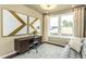 Functional home office with ample natural light, a modern desk, and neutral decor at 1606 Garden Park Cir, Fuquay Varina, NC 27526