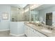 Bathroom featuring a walk-in shower with dual shower heads and granite countertops at 1614 Garden Park Cir, Fuquay Varina, NC 27526