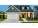 Charming single-Gathering home boasting a well-manicured lawn and an attached two-car garage at 1614 Garden Park Cir, Fuquay Varina, NC 27526