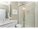 Bathroom features a large glass shower, white vanity, and neutral color palette at 1622 Garden Park Cir, Fuquay Varina, NC 27526