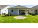 Charming backyard with a patio area and a well-maintained lawn, perfect for outdoor relaxation at 1626 Garden Park Cir, Fuquay Varina, NC 27526