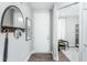 Home foyer with luxury vinyl plank flooring, umbrella stand, and coat rack at 1626 Garden Park Cir, Fuquay Varina, NC 27526