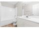 Well-lit bathroom featuring a tub-shower, white vanity, and wood-look flooring at 1628 Briarmont Court Ct, Raleigh, NC 27610