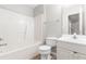 Bright bathroom featuring a tub-shower combination, white vanity, and neutral walls at 1628 Briarmont Court Ct, Raleigh, NC 27610