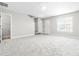 Cozy living space featuring neutral walls, plush carpeting, and plenty of natural light at 1628 Briarmont Court Ct, Raleigh, NC 27610