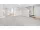 Bright living space with neutral walls, plush carpeting, and an open floor plan at 1628 Briarmont Court Ct, Raleigh, NC 27610