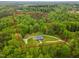 Aerial view shows approximate property lines for 11.03 acres wooded lot with home at 169 Country Brooke Lane Ln, Roxboro, NC 27574