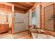 Luxurious bathroom featuring glass shower, soaking tub, and wooden vanity at 169 Country Brooke Lane Ln, Roxboro, NC 27574