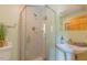Modern bathroom featuring glass-enclosed shower, tile walls, and pedestal sink at 169 Country Brooke Lane Ln, Roxboro, NC 27574