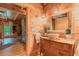 Charming bathroom featuring natural wood walls, a unique vessel sink, and vintage-style vanity at 169 Country Brooke Lane Ln, Roxboro, NC 27574