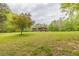 A stunning home exterior with a vast lawn and wooded surroundings at 169 Country Brooke Lane Ln, Roxboro, NC 27574