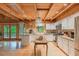 Well-lit kitchen featuring stainless steel appliances and white cabinetry at 169 Country Brooke Lane Ln, Roxboro, NC 27574
