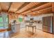 Modern kitchen featuring stainless steel appliances, white cabinets, and wood flooring at 169 Country Brooke Lane Ln, Roxboro, NC 27574