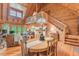Inviting living area with wood beams, open staircase, and a dining area with hardwood floors and ample natural light at 169 Country Brooke Lane Ln, Roxboro, NC 27574
