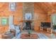Comfortable living room with stone fireplace, wood accents, and stylish decor at 169 Country Brooke Lane Ln, Roxboro, NC 27574