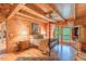 Serene main bedroom with a four-poster bed, wood floors, and a private balcony with a view of nature at 169 Country Brooke Lane Ln, Roxboro, NC 27574
