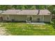 Lush backyard featuring a charming patio with comfortable seating, ideal for relaxation and outdoor enjoyment at 1800 Tarbert Dr, Cary, NC 27511