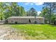 Spacious backyard featuring a cozy patio area perfect for outdoor relaxation and entertaining, surrounded by lush greenery at 1800 Tarbert Dr, Cary, NC 27511