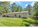 The home's backyard offers a cozy patio with furniture and a grill at 1800 Tarbert Dr, Cary, NC 27511