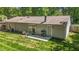 Charming patio with seating and grill, perfect for outdoor entertaining, surrounded by a lush, green lawn at 1800 Tarbert Dr, Cary, NC 27511