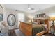 Bright bedroom featuring wood furnishings, decor, and a ceiling fan at 1800 Tarbert Dr, Cary, NC 27511