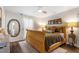 Inviting bedroom with wood accents and a decorative mirror at 1800 Tarbert Dr, Cary, NC 27511