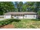 Charming single-story home with a well-manicured lawn and inviting front entrance and one-car garage at 1800 Tarbert Dr, Cary, NC 27511