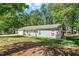 Charming home featuring a neatly manicured lawn, complemented by a welcoming front porch and attached garage at 1800 Tarbert Dr, Cary, NC 27511