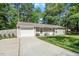 Charming single-story home with well-maintained lawn and attached garage at 1800 Tarbert Dr, Cary, NC 27511