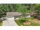 Beautiful home with a manicured lawn, shade trees, and an attached garage at 1800 Tarbert Dr, Cary, NC 27511