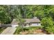 Charming single-story home with well-maintained lawn and mature trees at 1800 Tarbert Dr, Cary, NC 27511
