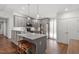 Modern kitchen with an island, stainless steel appliances, and ample cabinet space at 1800 Tarbert Dr, Cary, NC 27511