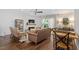 Cozy living room with fireplace, ceiling fan, lots of seating, and an open floorplan at 1800 Tarbert Dr, Cary, NC 27511