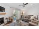Spacious living room with fireplace, neutral décor, and an open layout with access to the patio at 1800 Tarbert Dr, Cary, NC 27511