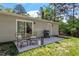 Comfortable patio with chairs and grill, perfect for outdoor entertaining and relaxation at 1800 Tarbert Dr, Cary, NC 27511