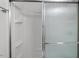 Bathroom with a glass-enclosed shower and clean, white interiors at 1800 Tarbert Dr, Cary, NC 27511