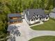 Beautiful aerial view of a property featuring a paved driveway and a detached three-car garage at 1903 Edgerton Dr, Durham, NC 27703