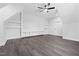 Bright bedroom featuring hardwood floors and built-in shelves for storage and decor at 1903 Edgerton Dr, Durham, NC 27703